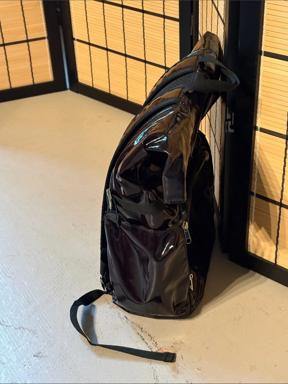 Isaac Mizrahi black patent leather rolltop backpack. IMNYC